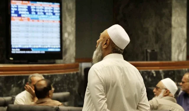 Electronic board displays rising KSE-100 index at Pakistan Stock Exchange.