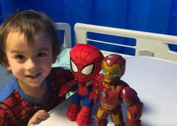 Child undergoing teplizumab infusion in hospital to delay onset of type 1 diabetes.