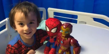 Child undergoing teplizumab infusion in hospital to delay onset of type 1 diabetes.
