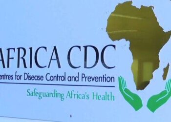 Africa CDC headquarters with officials reviewing pandemic funding and accreditation documents in Addis Ababa.