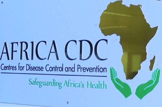 Africa CDC headquarters with officials reviewing pandemic funding and accreditation documents in Addis Ababa.