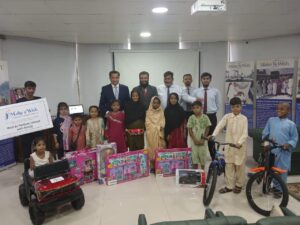 Children receive gifts during a Make-A-Wish Pakistan event supported by Meezan Bank. POHTO BY THE AZB