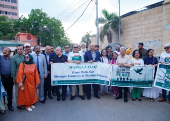 Business leaders and media participate in Karachi peace walk advocating economic reform and stability. PHOTO BY THE AZB