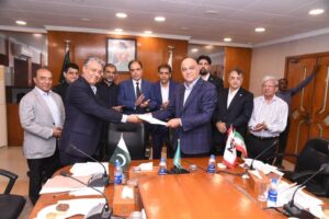 Pakistani and Iranian delegates signing LPG Pakistan MoU at Federation House Karachi to boost energy investment cooperation.