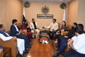 Ambassador Emmanuel R. Fernandez with ICSTSI members during the National Day ceremony in Islamabad.