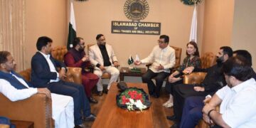 Ambassador Emmanuel R. Fernandez with ICSTSI members during the National Day ceremony in Islamabad.