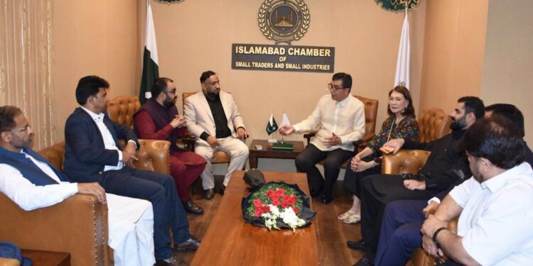 Ambassador Emmanuel R. Fernandez with ICSTSI members during the National Day ceremony in Islamabad.