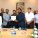 Officials of Pakistan Tanners Association and Sindh government exchange crests during an industry meeting in Karachi.