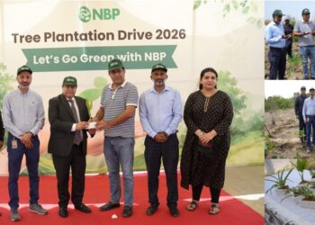 National Bank of Pakistan officials and participants planting saplings during an environmental sustainability initiative in Karachi.