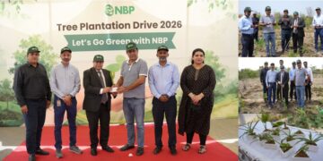 National Bank of Pakistan officials and participants planting saplings during an environmental sustainability initiative in Karachi.