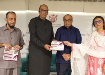 Dr Saira Bano presenting Whispers of Wellness during recognition ceremony.