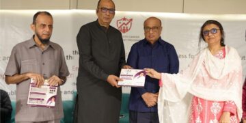 Dr Saira Bano presenting Whispers of Wellness during recognition ceremony.