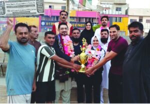 Participants competing in shooting ball and athletics events at Abdul Haq Sports Festival held in Karachi