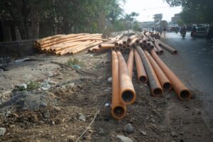 Damaged Karachi road awaiting reconstruction after SSGC pipeline installation work.