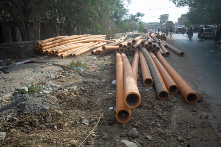 Damaged Karachi road awaiting reconstruction after SSGC pipeline installation work.