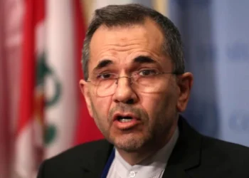 US-Iran deal signing ceremony in Switzerland with diplomats and national flags