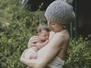 Pregnant woman reflecting on body image changes during pregnancy