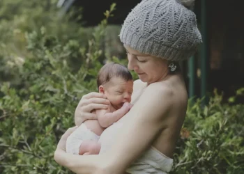 Pregnant woman reflecting on body image changes during pregnancy