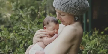 Pregnant woman reflecting on body image changes during pregnancy