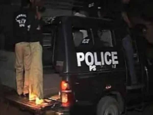 Karachi Police officers at the site of separate alleged encounters in Steel Town and Nazimabad