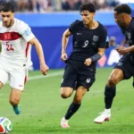 Türkiye football team celebrating during their FIFA World Cup Group D match against the United States.