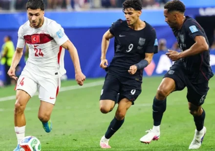 Türkiye football team celebrating during their FIFA World Cup Group D match against the United States.