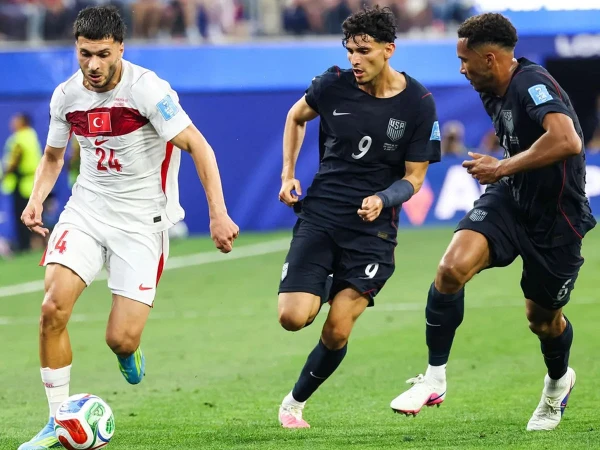 Türkiye football team celebrating during their FIFA World Cup Group D match against the United States.
