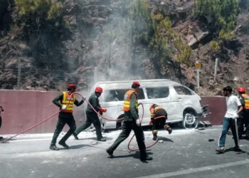 Rescue teams respond after a passenger van crash and fire on Murree Expressway near Rawalpindi.