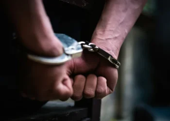 Recovered cocaine, mobile phones and a pistol seized by SIU police during operations in Karachi.