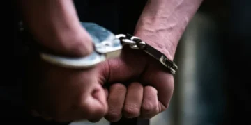Recovered cocaine, mobile phones and a pistol seized by SIU police during operations in Karachi.