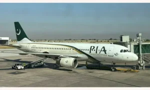 Pakistan International Airlines aircraft departing Lahore on the first direct flight to Manchester after six years.