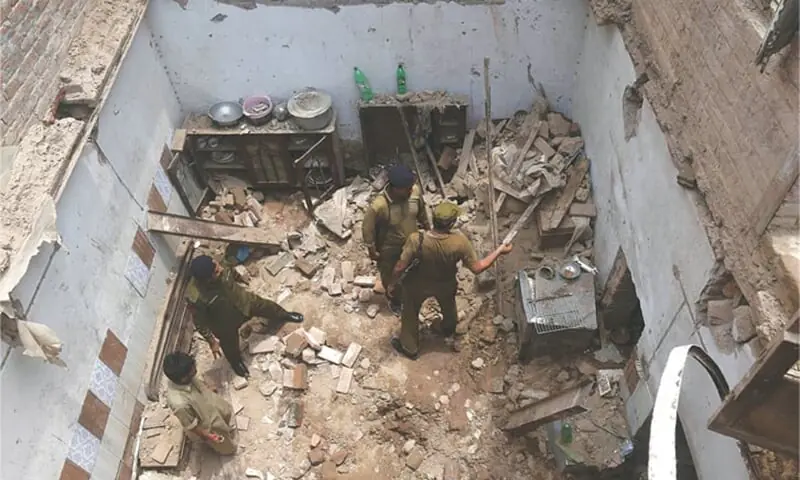 Rescue workers clearing rubble after the roof of an under-construction house collapsed in Lahore's Baghbanpura area.