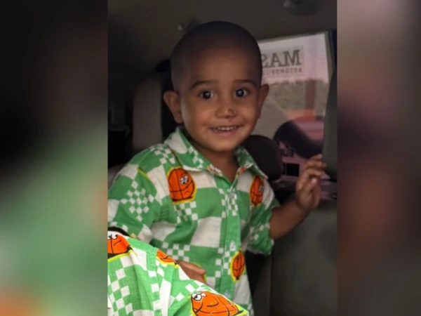 Police officers investigate after a two-year-old boy was allegedly abducted from a private housing society in Karachi's Manghopir area.