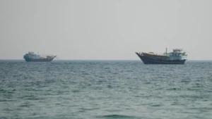 Oil tankers transiting the Strait of Hormuz amid escalating US-Iran military conflict.