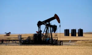 Oil storage facilities and tankers as crude prices fall following progress in US-Iran negotiations.