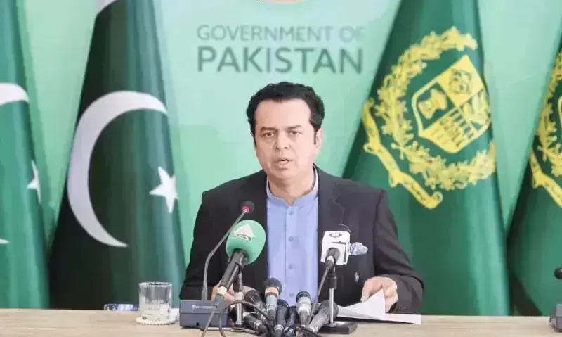 A Pakistani blue official passport displayed alongside government documents related to passport policy.