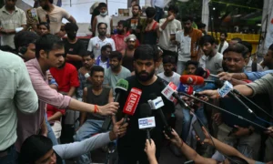 Demonstrators march during the Cockroach Movement protest in New Delhi calling for education reforms