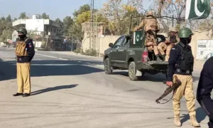 Police and security forces at the Khazina Banda checkpost in Hangu following a militant attack that killed nine officers.