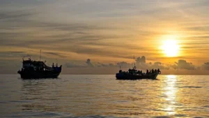 Rohingya refugees board overcrowded boats while fleeing conflict and humanitarian conditions in Myanmar.