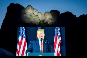 President Donald Trump speaks beneath Mount Rushmore during America's 250th Independence anniversary.