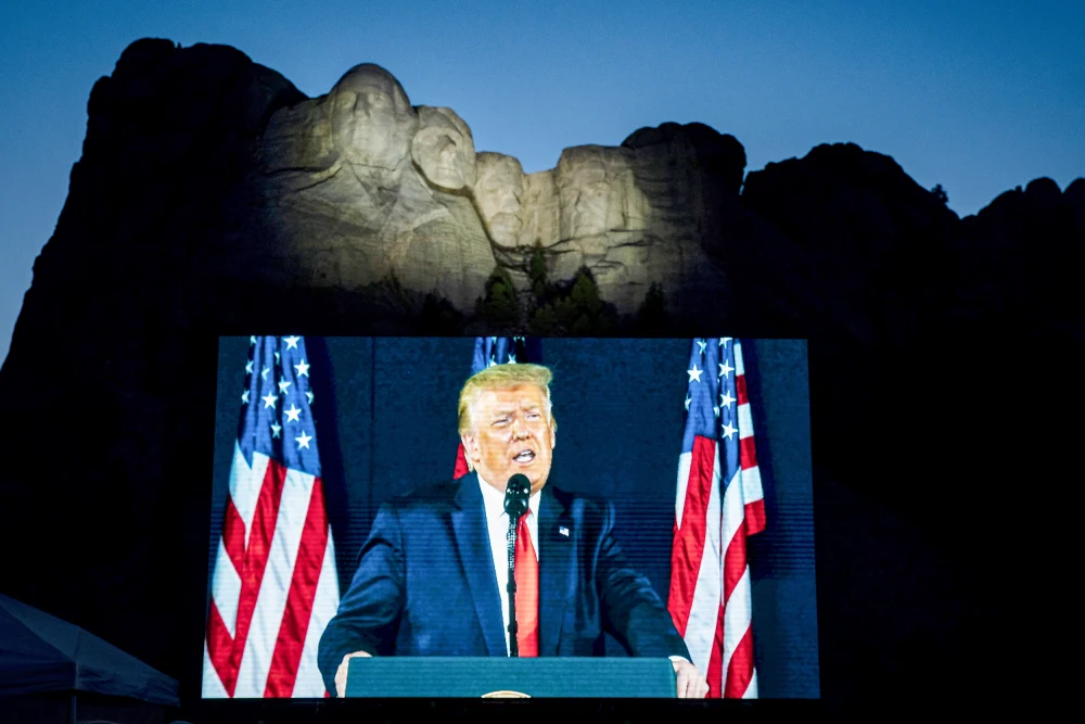 President Donald Trump speaks beneath Mount Rushmore during America's 250th Independence anniversary.