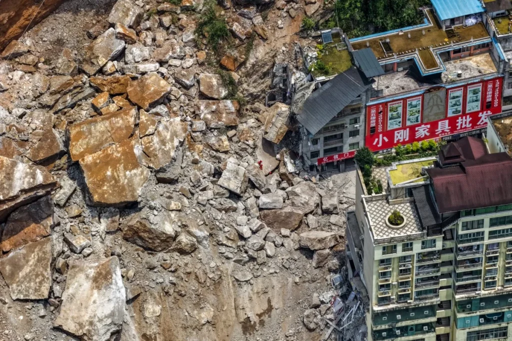 Emergency rescuers working at the site of a landslide in Chongqing, southwestern China.