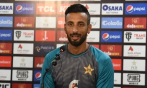 Pakistan captain Shan Masood receives treatment after fracturing his left index finger during the first Test against the West Indies.