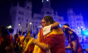 Spain fans wave flags and light flares in Madrid after the national team defeated Argentina to win the FIFA World Cup.