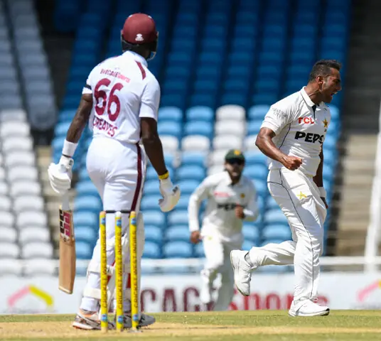 Pakistan players celebrate after taking a wicket against the West Indies during the first Test at the Brian Lara Stadium.