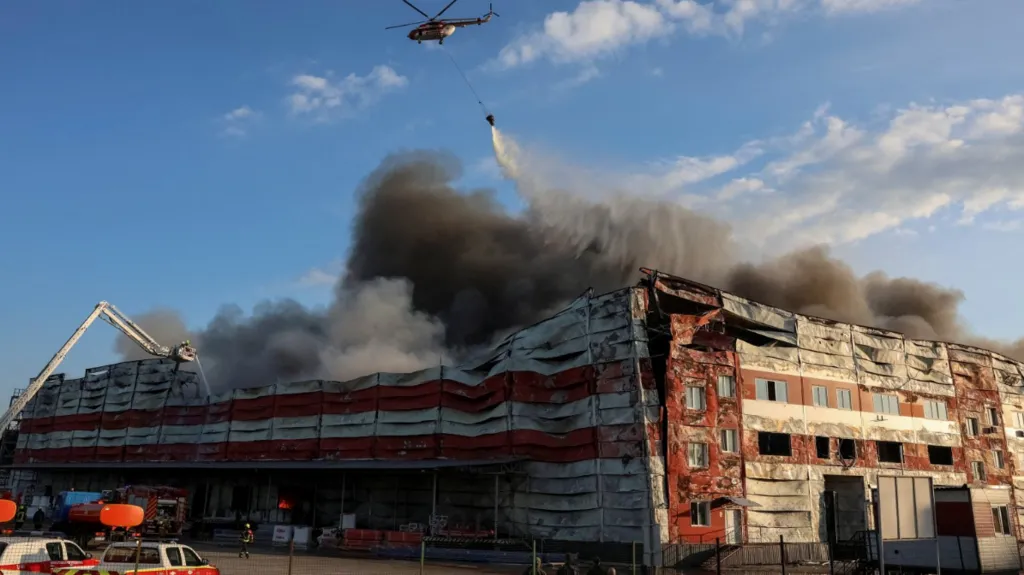 Emergency responders work at the scene of Russian missile strikes in Kyiv following a large-scale overnight attack.
