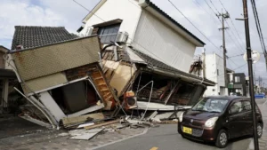 Emergency responders conduct search and rescue operations amid collapsed buildings following the Kumamoto earthquake in Japan.