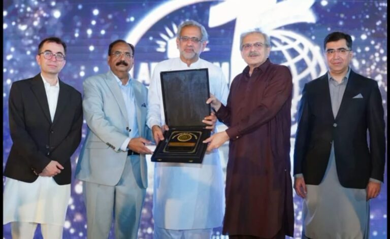 Shahid Khaqan Abbasi speaking at an Al Khair Hajj Group ceremony in Karachi on Pakistan's economy and exports.