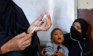 Healthcare worker vaccinates a child as Pakistan faces a growing zero-dose immunisation crisis.