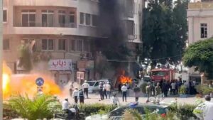 Smoke rises near the Four Seasons Hotel in Damascus after explosions injured several people during Emmanuel Macron's official visit.